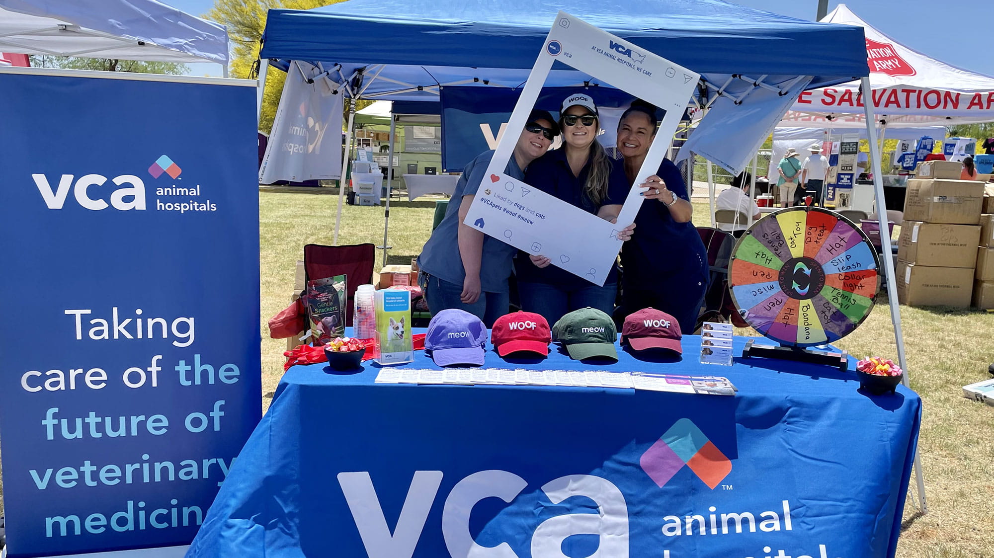 VCA Associates posing at a booth with VCA gear