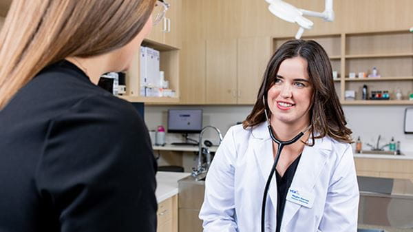 Urgent Care veterinarian talking to a client